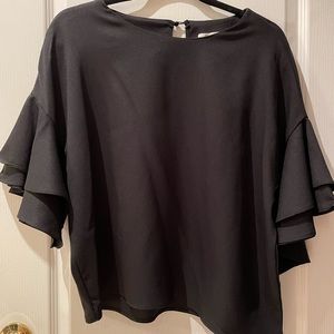 Stunning black blouse with ruffle detailing on sleeve
